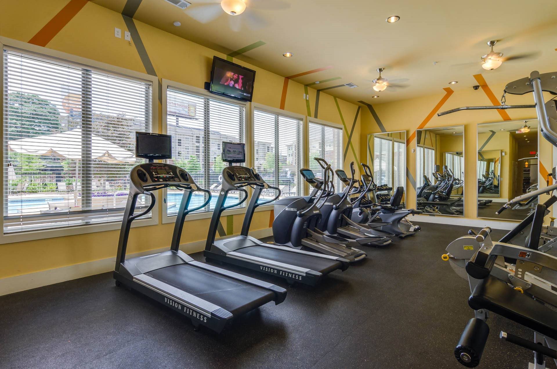 Fitness Center Fitness room fully equiped with cardio and strength machines as well as free weights at Ashley Auburn Pointe in Atlanta, GA